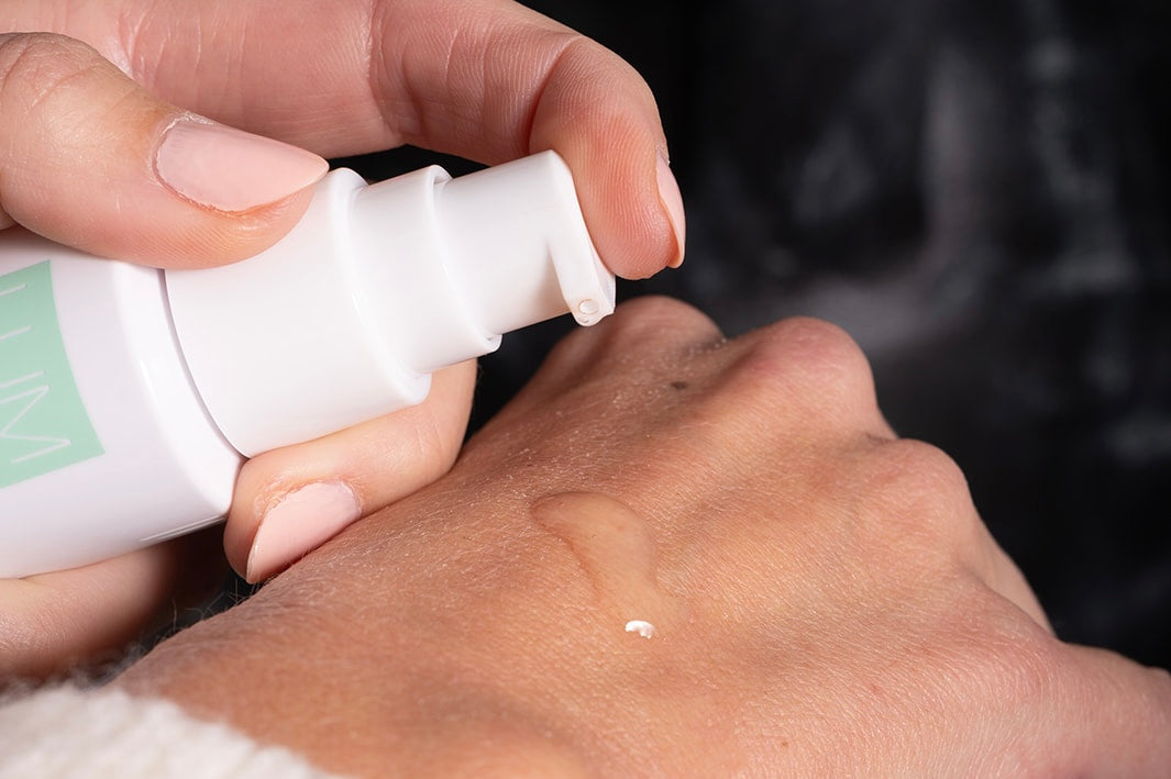 LUMION Skin Save My Skin Serum on a woman's hand.
